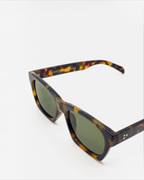 House of Holabox Ria square sunglasses in a classic tort acrylic frame with dark tinted lenses and gold pin details.