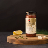 House of Holabox Yarra Valley Preserves roasted capsicum and chilli relish in a glass jar on a wooden board.