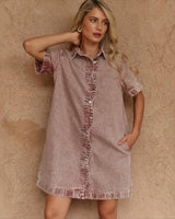 House of Holabox rusty red cotton denim mini dress with a collared neckline, button-through front, and wave seam detail.