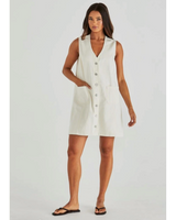 Model wearing House of Holabox Sabine cream denim vest dress with patch pockets and contrast stitching