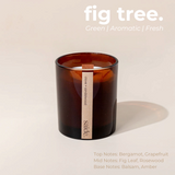 House of Holabox saide. large amber glass soy candle with a wood wick and clove and sandalwood label