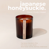 House of Holabox saide. large amber glass soy candle with a wood wick and minimalist label on a neutral background.