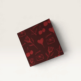 House of Holabox Salty Melon Prints recycled greeting card with red romantic cherry, rose, and heart pattern.
