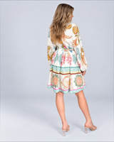 House of Holabox Sara mini dress in yellow floral print with billowing sleeves and tie waist, back view