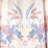 House of Holabox Sara Spring Maxi Dress featuring a delicate floral print on soft cotton fabric with pastel tones.
