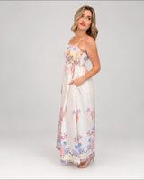 Model wearing House of Holabox Sara Spring Maxi Dress in yellow floral print cotton with ruching and side pockets