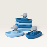 House of Holabox Boatman silicone stacking boat toys in shades of blue with grey captain figures for sensory play