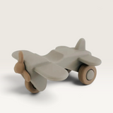 House of Holabox Henry & Flo soft silicone toy airplane in grey and brown, durable BPA-free material for toddlers.