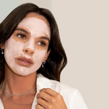 Facial clay mask, Stray Willow Peach Tea, shown as a creamy white mask applied across the face.