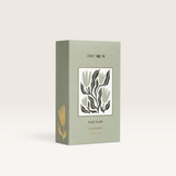 House of Holabox Stray Willow Green Smoothie body scrub in a sage green box with botanical floral illustration.