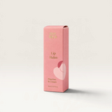 House of Holabox Stray Willow Peaches and Cream lip balm in a compact pink cardboard box.