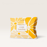 House of Holabox Stray Willow Golden Glow self-care gift set featuring a facial mask and shimmer bath salts in a box.