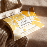 House of Holabox Stray Willow Golden Glow self-care gift set featuring a facial mask and shimmer bath salts in yellow.