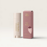 House of Holabox Stray Willow strawberry lip balm tube and matching pink cardboard box with strawberry illustration.