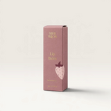 House of Holabox Stray Willow strawberry lip balm in a compact mauve cardboard box with a cute strawberry illustration.