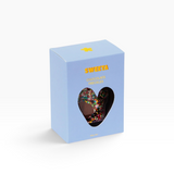 House of Holabox Sweeta chocolate freckles in a light blue gift box with a heart-shaped window showing milk chocolate
