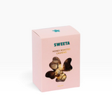 House of Holabox Sweeta honey roasted cashews in a pink box with a flower-shaped window showing the nuts inside.