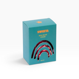 House of Holabox Sweeta mini musk sticks in a teal box with a rainbow-shaped window showing pink candy inside.