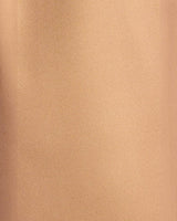 Close-up of the smooth tan polyester fabric used for House of Holabox Bermuda long line shorts.