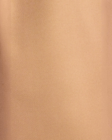 Close-up of the smooth tan polyester fabric used for House of Holabox Bermuda long line shorts.