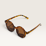 House of Holabox Little Drop kids sunglasses in tortoise shell pattern with round frames and UV400 protection