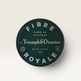 House of Holabox Triumph & Disaster Fibre Royale strong hold hair styling cream in a dark green circular tin.