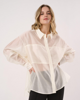 House of Holabox Val oversized cream button-through shirt with a collared neckline worn by a model.