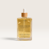 House of Holabox Soaked Body Bar Vanilla Dreams nourishing bath and body oil in a glass bottle with dried botanicals.