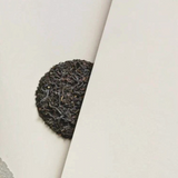 House of Holabox Wattleseed Breakfast loose leaf black tea with native wattleseed on a minimalist beige background.