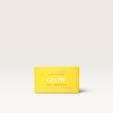 House of Holabox Wild Emery Glow shower steamer in a bright yellow rectangular bar with lemon and myrtle scent.