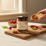 House of Holabox Yarra Valley Preserves Mustard Chilli jar with a slice of bread spread with mustard on a board