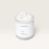 House of Holabox Cleanse & Co. Howlite crystal intention candle in a frosted glass jar with soy and coconut wax.