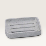 House of Holabox Huxter pale grey handcrafted concrete soap dish with drainage grooves and minimalist design.