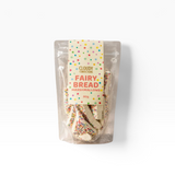 House of Holabox Cloudy Confections triangle marshmallows covered in rainbow sprinkles in a clear resealable pouch.