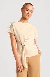 Beige Saddie batwing sleeve top in satin fabric featuring an organic side ring bead detail.