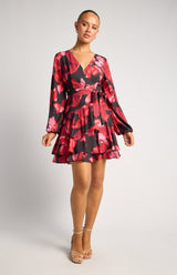 Faith Floral Mini Dress in red and black with a wrap-style V-neckline and layered ruffle hem.