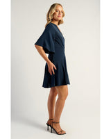 Navy Belle Wrap Dress featuring elegant bell sleeves and a flattering faux wrap silhouette.