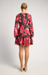 Faith Floral Mini Dress in black and red with long sleeves and a layered ruffle hem, viewed from the back.