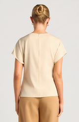 Back view of the beige Saddie Batwing Sleeve Top in satin fabric with a centre back invisible zip.