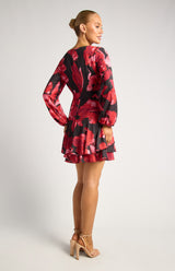 Faith Floral Mini Dress in black and red with long sleeves and a layered ruffle hem.