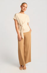 Saddie Batwing Sleeve Top in cream satin featuring an organic side ring bead detail and a round neckline.