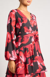 Faith Floral mini dress in black and red with a wrap-style V-neckline and tie waist.