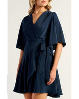 Navy Belle Wrap Dress featuring elegant bell sleeves and a flattering faux wrap silhouette.