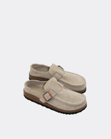 Pair of beige loafers on a white background