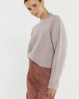 Pink marle pointelle knit jumper with a relaxed fit, dropped shoulders, and wide ribbed neckline.