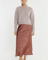 Pink marle wool-blend pointelle jumper with a relaxed fit, dropped shoulders, and wide ribbed neckline.