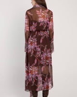 Back view of Isla wrap dress in dark floral print viscose yoryu with collared neckline and long sleeves.