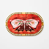 Decorative plate with butterfly design on a white background