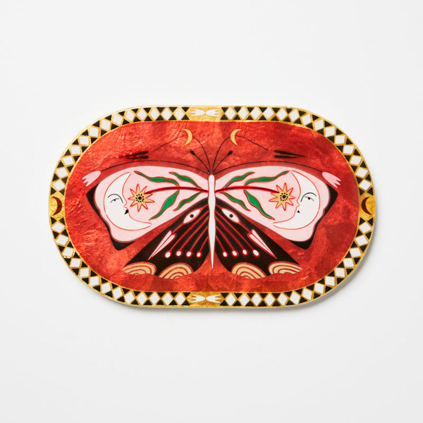 Decorative plate with butterfly design on a white background