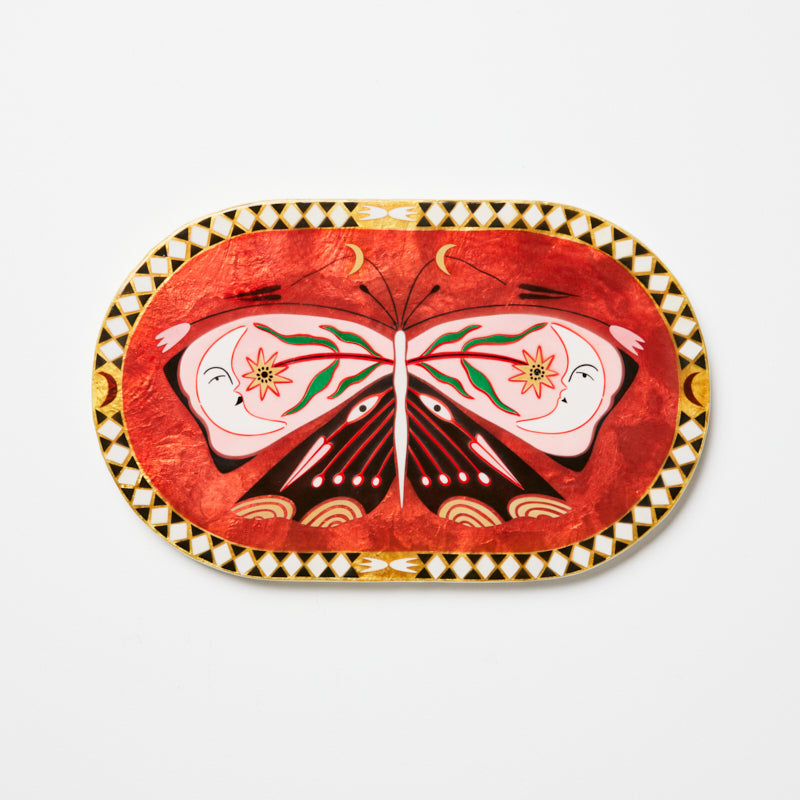 Decorative plate with butterfly design on a white background